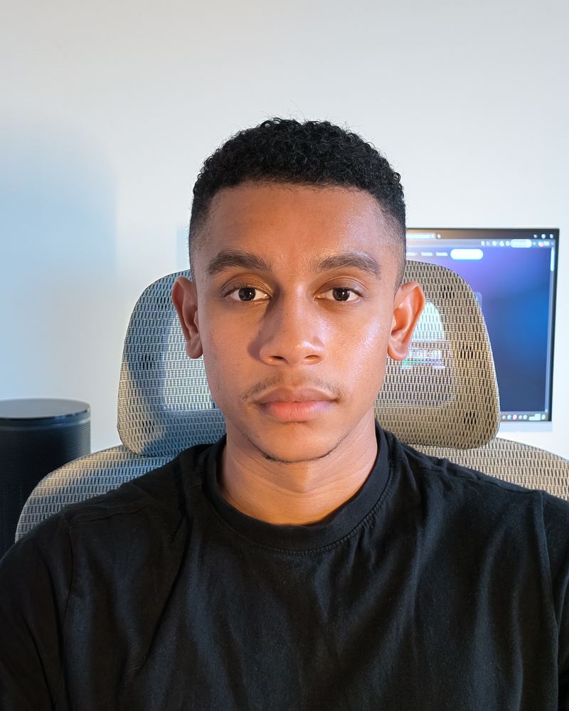 Jayden at the desk where every site is designed and built